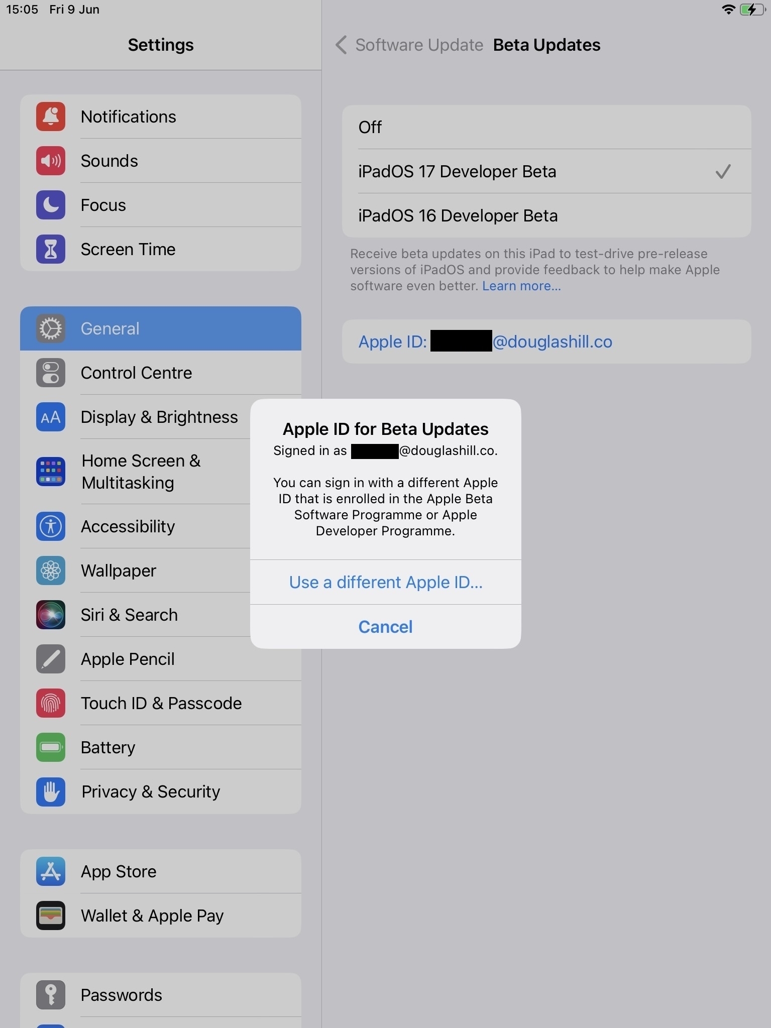 Screenshot of alert in the iPad Settings app: Apple ID for Beta Updates: Signed in as redacted@douglashill.co. You can sign in with a different Apple ID that is enrolled in the Apple Beta Software Programme or Apple Developer Programme. Button options: Use a different Apple ID… Cancel
