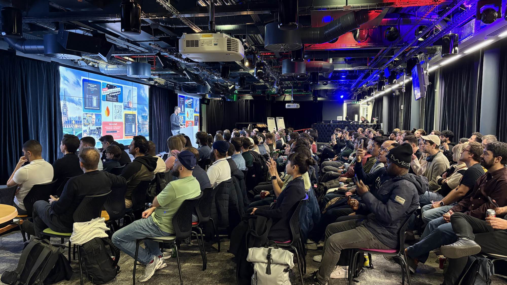 Photo during Peter Friese’s talk — Have Your Cake and Eat It Too: Hybrid AI with Apple Intelligence and Firebase AI Logic