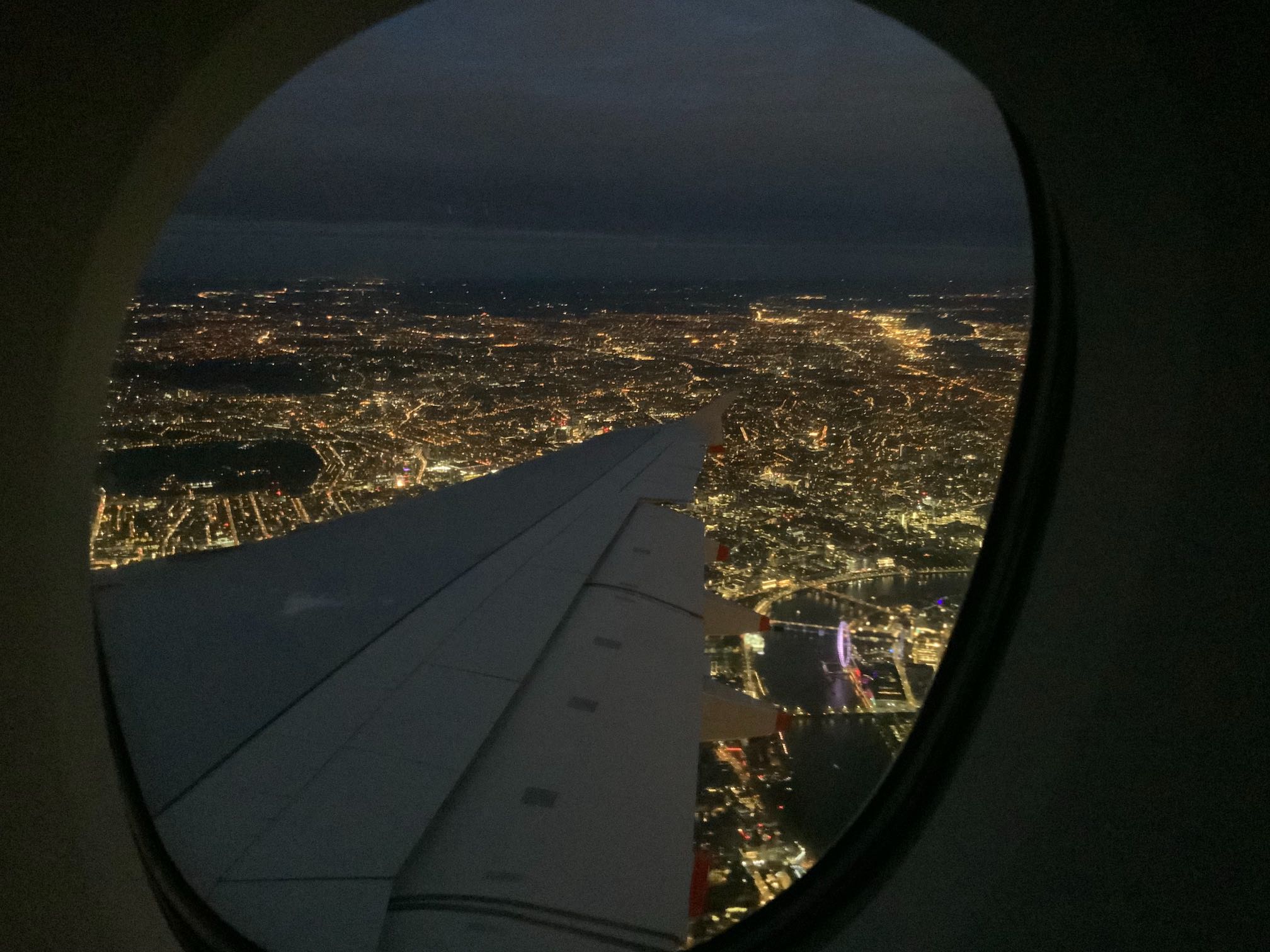 Photo of London at night from a plane window.