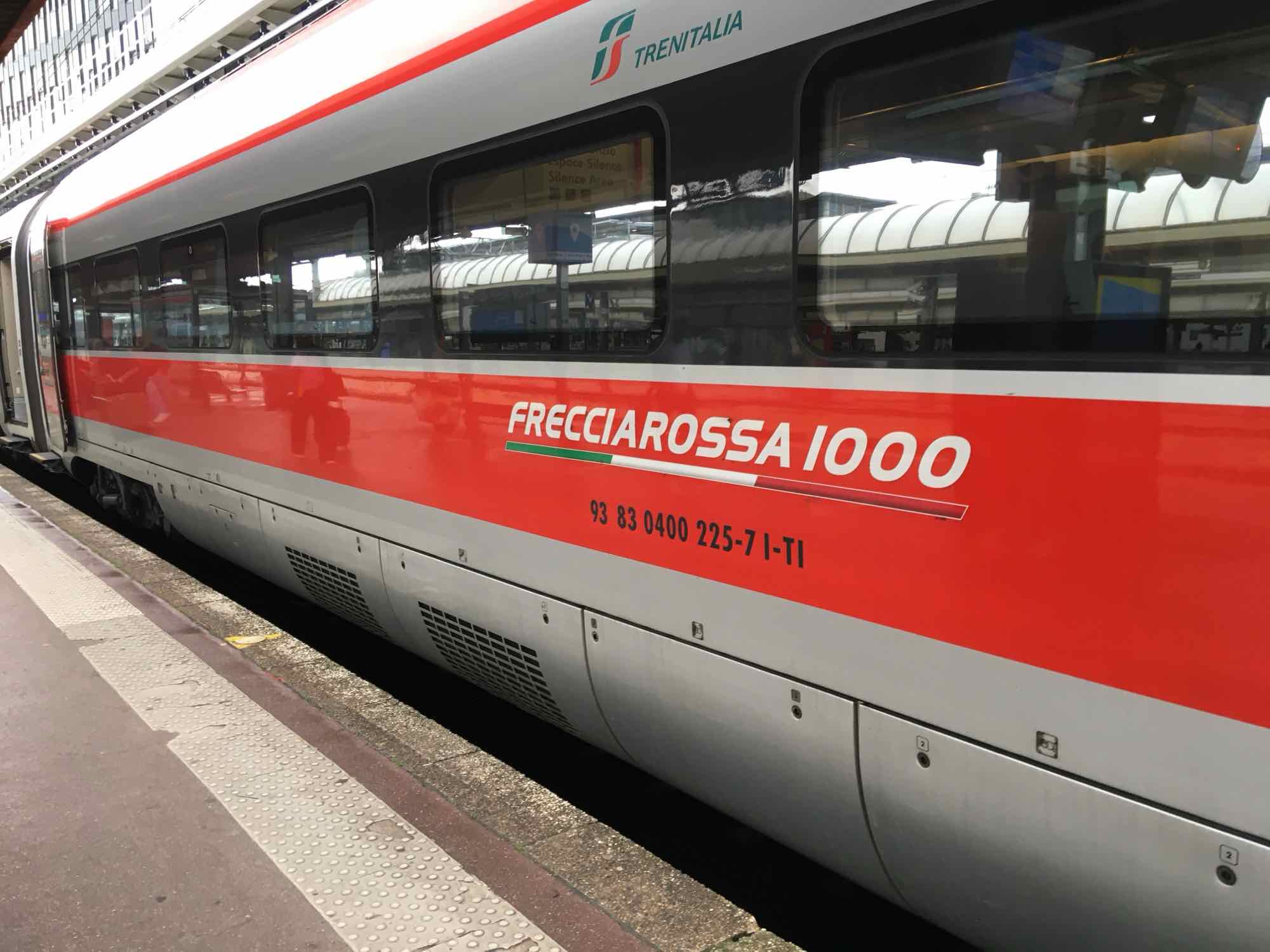 Photo of a Trenitalia Frecciarossa 1000 train at the platform