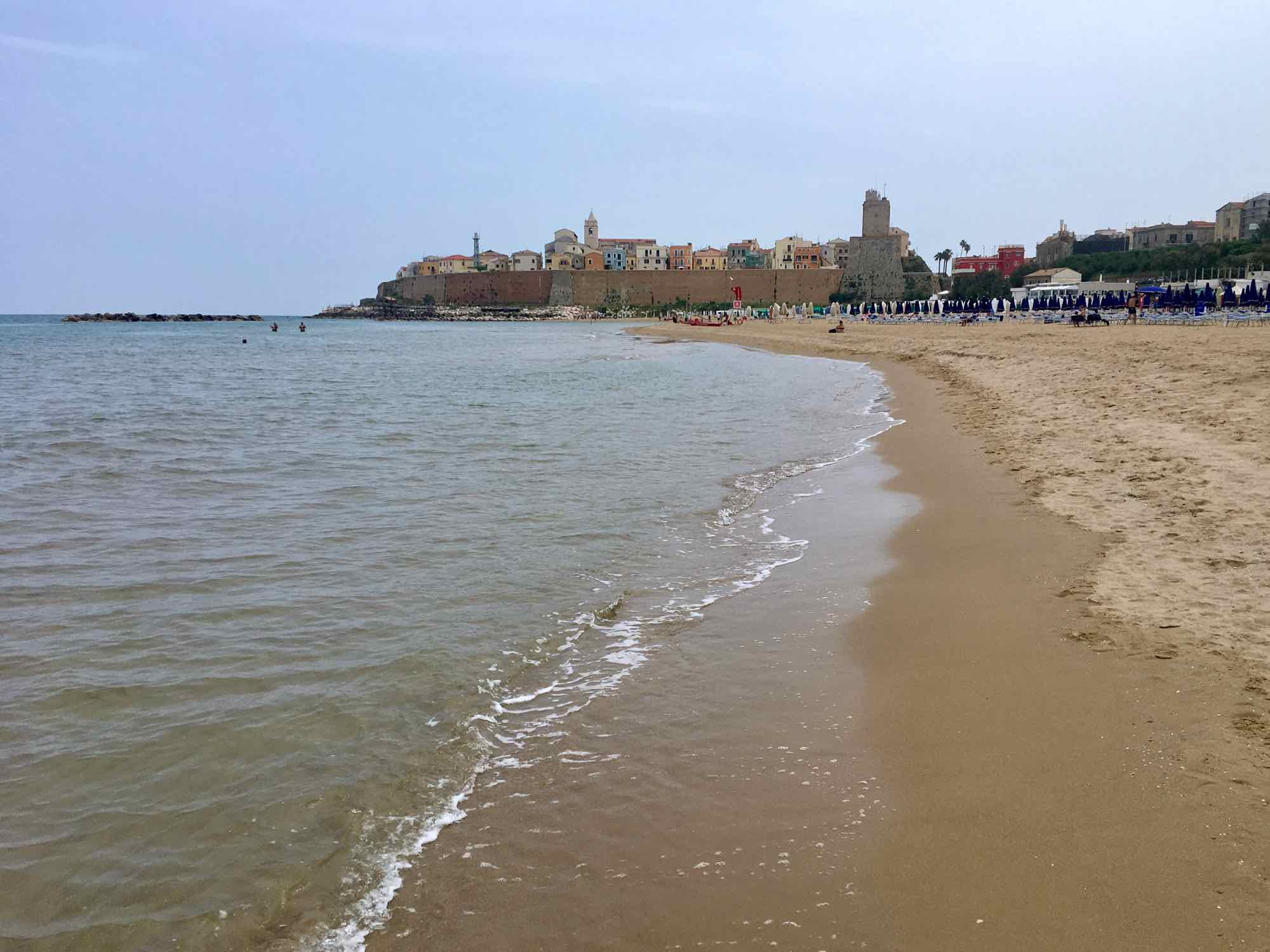 Photo of beach and old town